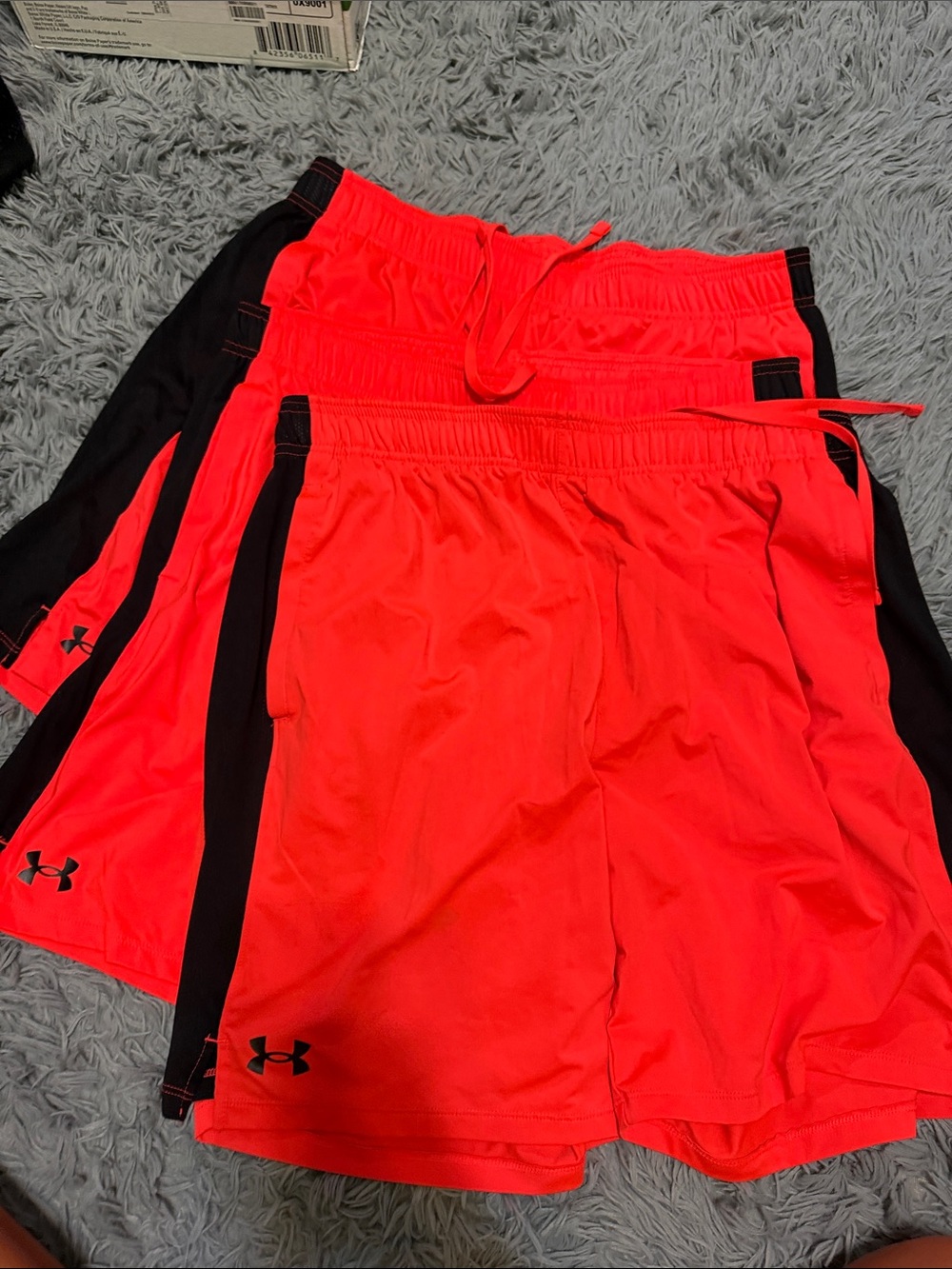Under Armour men’s Neon orange Shorts with Black Side Panels